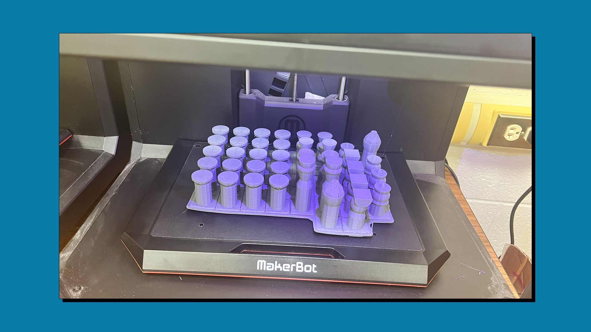 A set of 3D printed board game pieces on a MakerBot 3D printer.