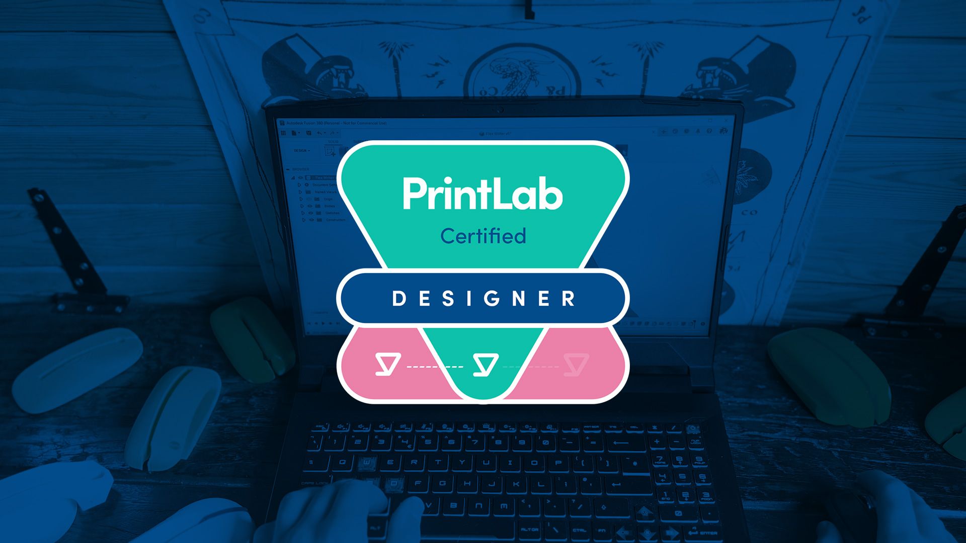 PrintLab Certified Designer badge overlaid onto an image of a design workspace.