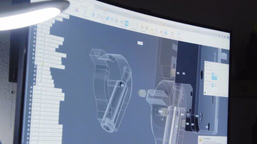 Computer monitor showing a mechanical design in Autodesk Fusion.