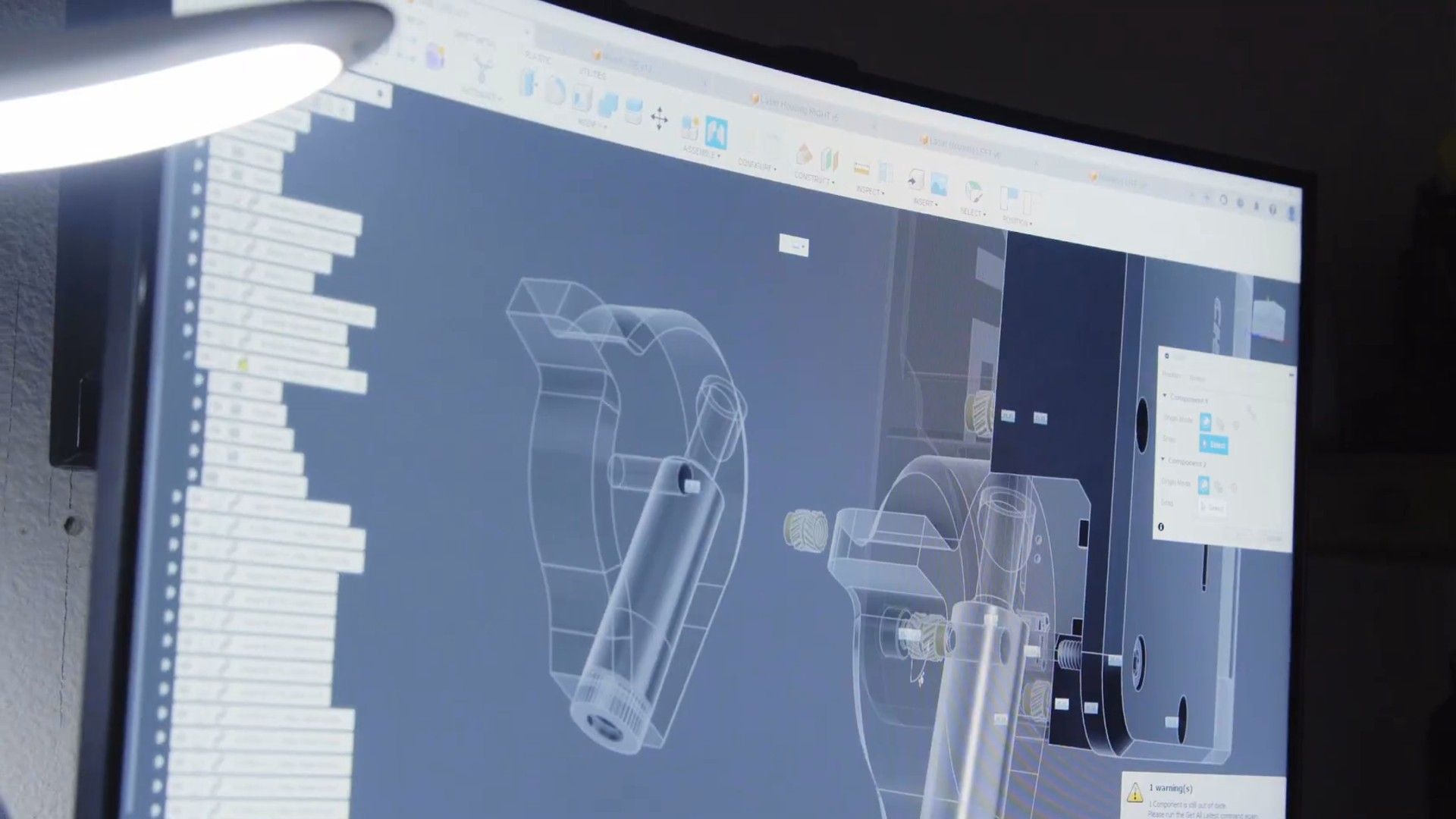 Computer monitor showing a mechanical design in Autodesk Fusion.