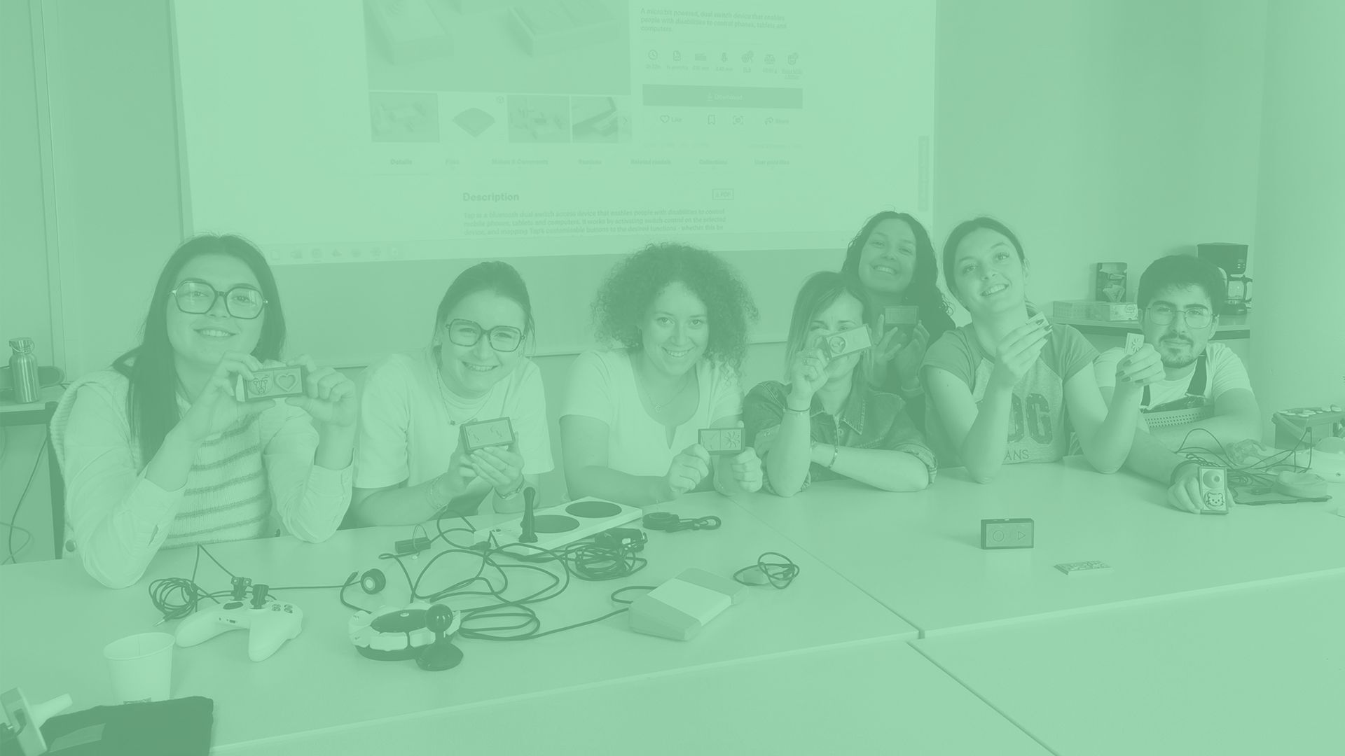 A group of students holding up their 3D printed 'Tap' switches.