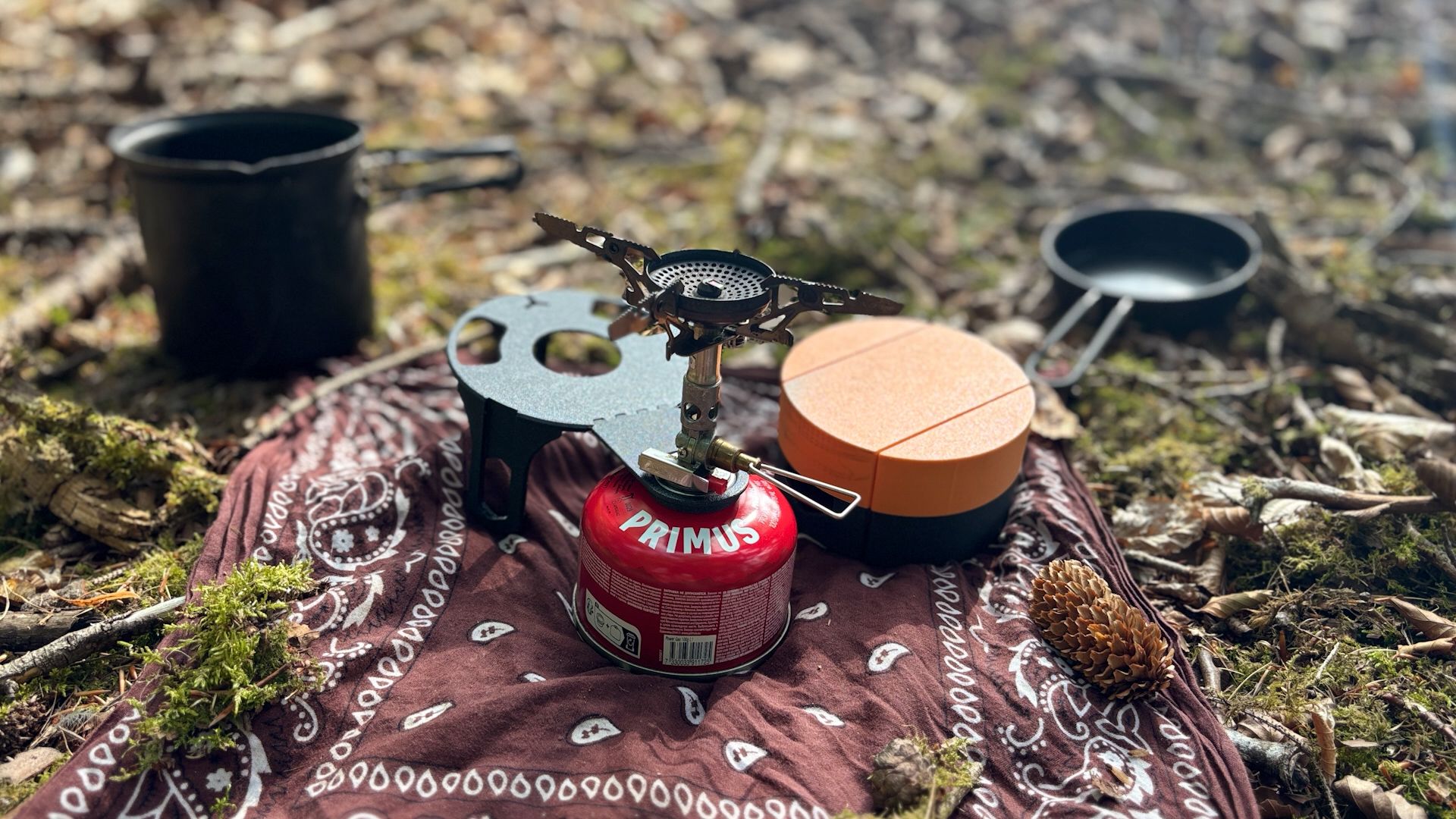 A 3D printed cooking set resting on the ground.