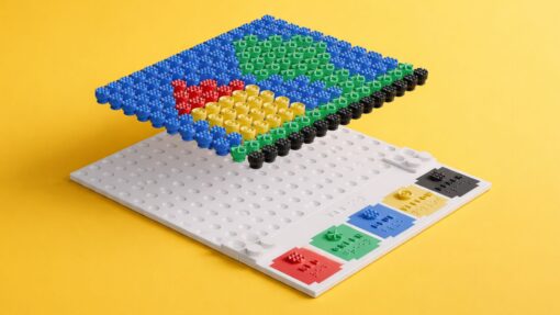 3D printed KIBO tactile art board with colourful textured bolts forming a design on a yellow background.
