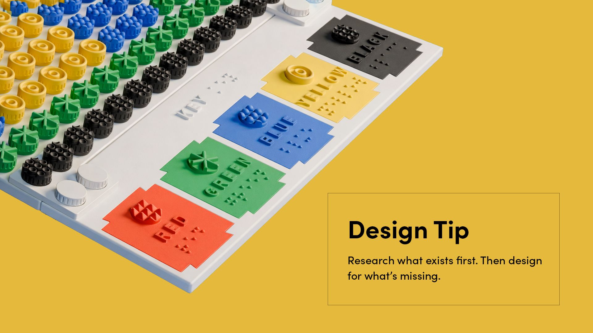 Close-up of the KIBO tactile art board colour key and textured bolt design on a yellow background.