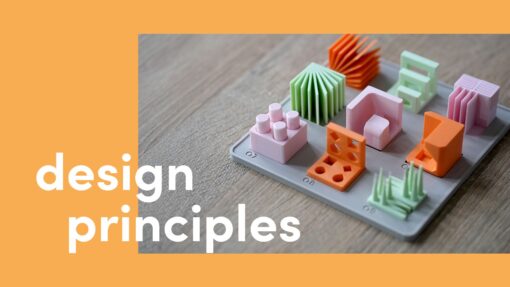 3D printed design principles model set on a base plate, featuring colourful test cubes demonstrating overhangs, holes, bridging, and other 3D printing features, with “design principles” text overlay.