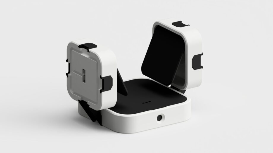 Two modular PrintSwitch angled assistive switches mounted on a central base using adjustable connectors.