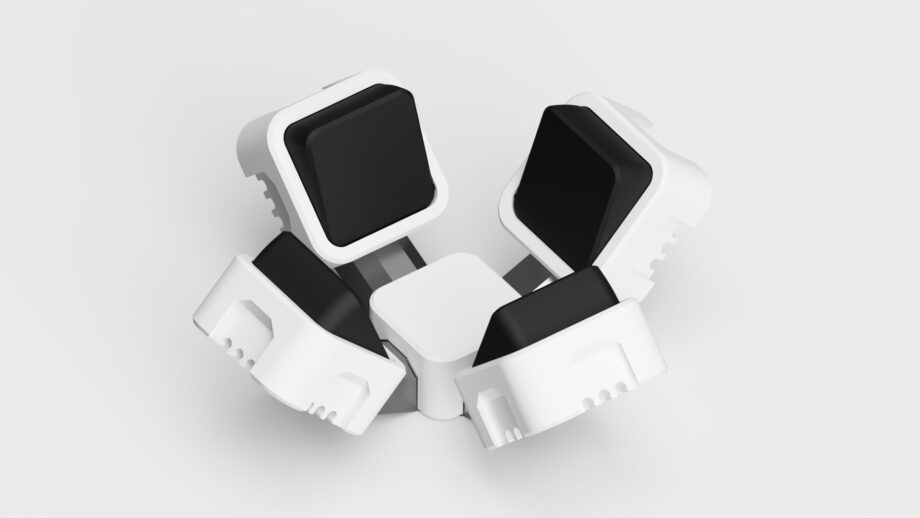 Modular PrintSwitch chin controller with two angled switches and a central push switch for accessible device control.