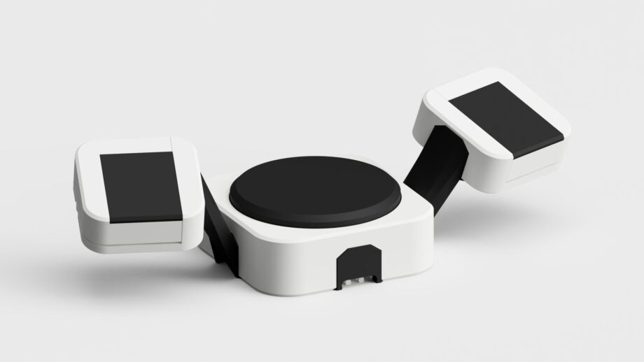 Handheld PrintSwitch controller with two angled switches and a central tactile button.